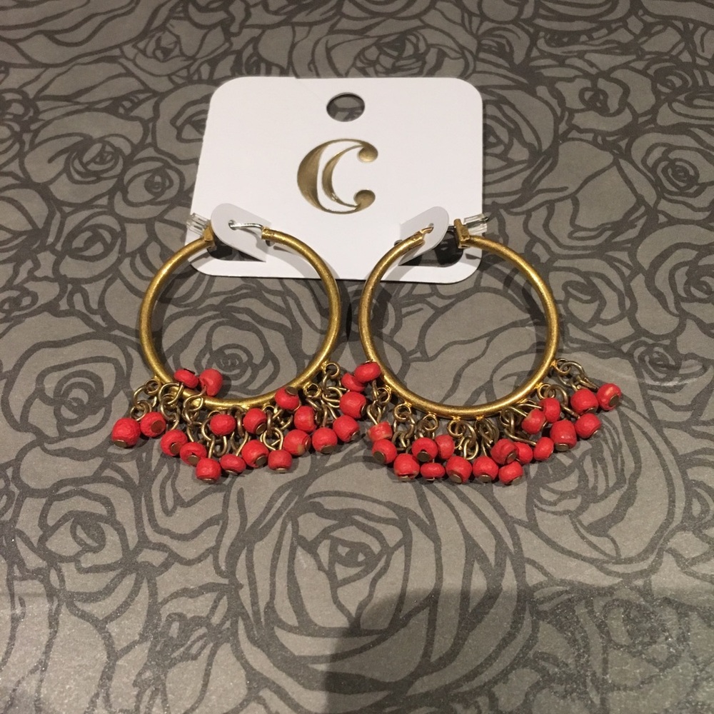 Coral and gold colored earrings